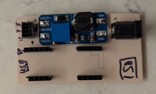 White rectangular PCB with connectors on a countertop
